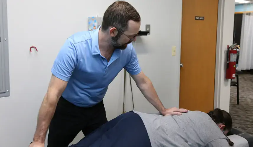 Chiropractor using advanced chiropractic techniques to treat a patient with sciatica pain in Arlington Heights, IL.