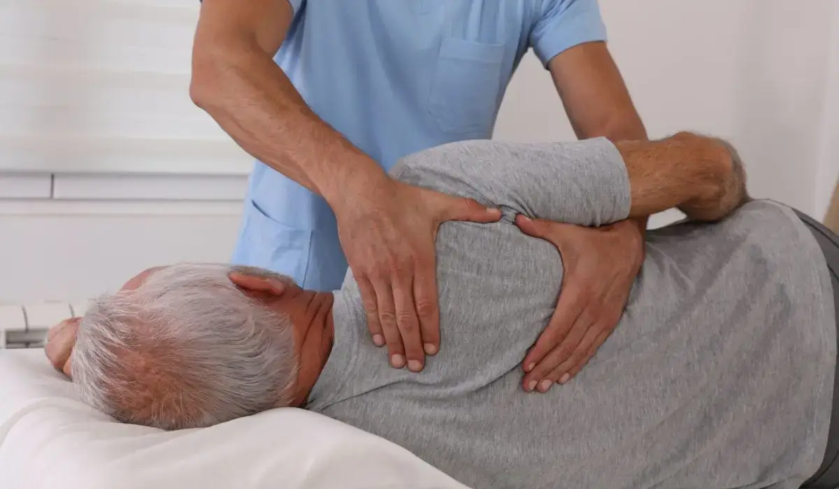 Chiropractor performing a spinal adjustment on a senior patient to support Arthritis Pain Management and improve joint mobility.