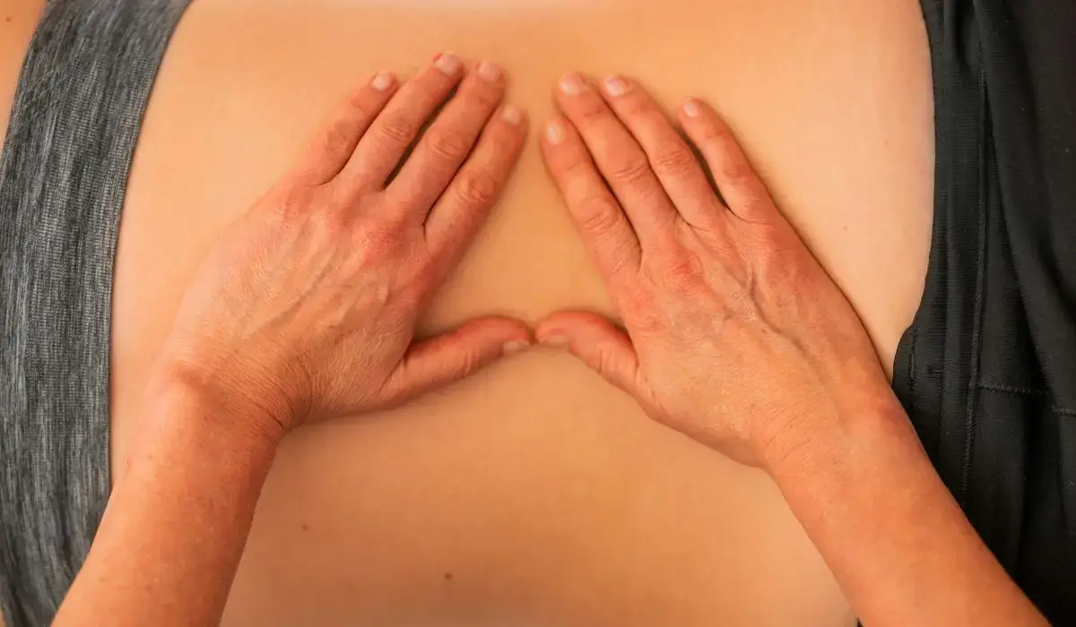 Close-up of manual therapy focused on the lower back area during chiropractic care.