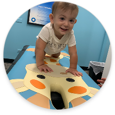 Child receiving gentle chiropractic care, representing support for abdominal and digestive health