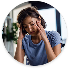 Woman experiencing headache or neck pain, representing chiropractic care for pain relief