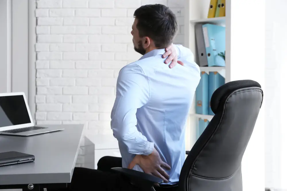 a man suffering from a back pain