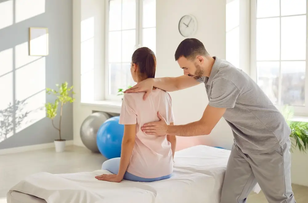 chiropractic adjusting the back pain