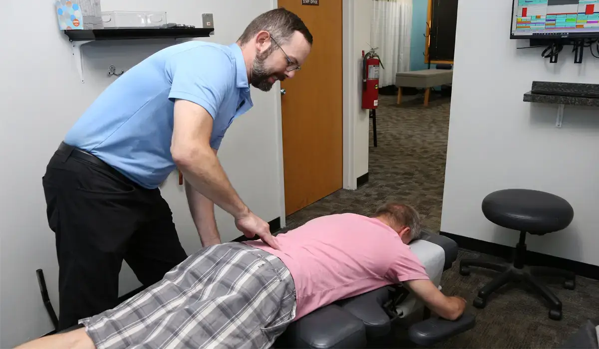 A chiropractor uses chiropractic techniques to treat back pain.