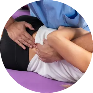 chiropractic adjusting the back of the woman