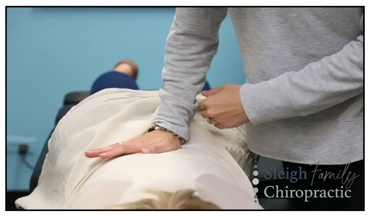 Chiropractic adjustment for mid-back pain.