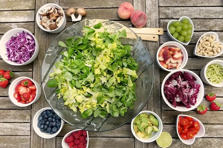 A colorful bowl of salad filled with a variety of fresh fruits and vegetables.